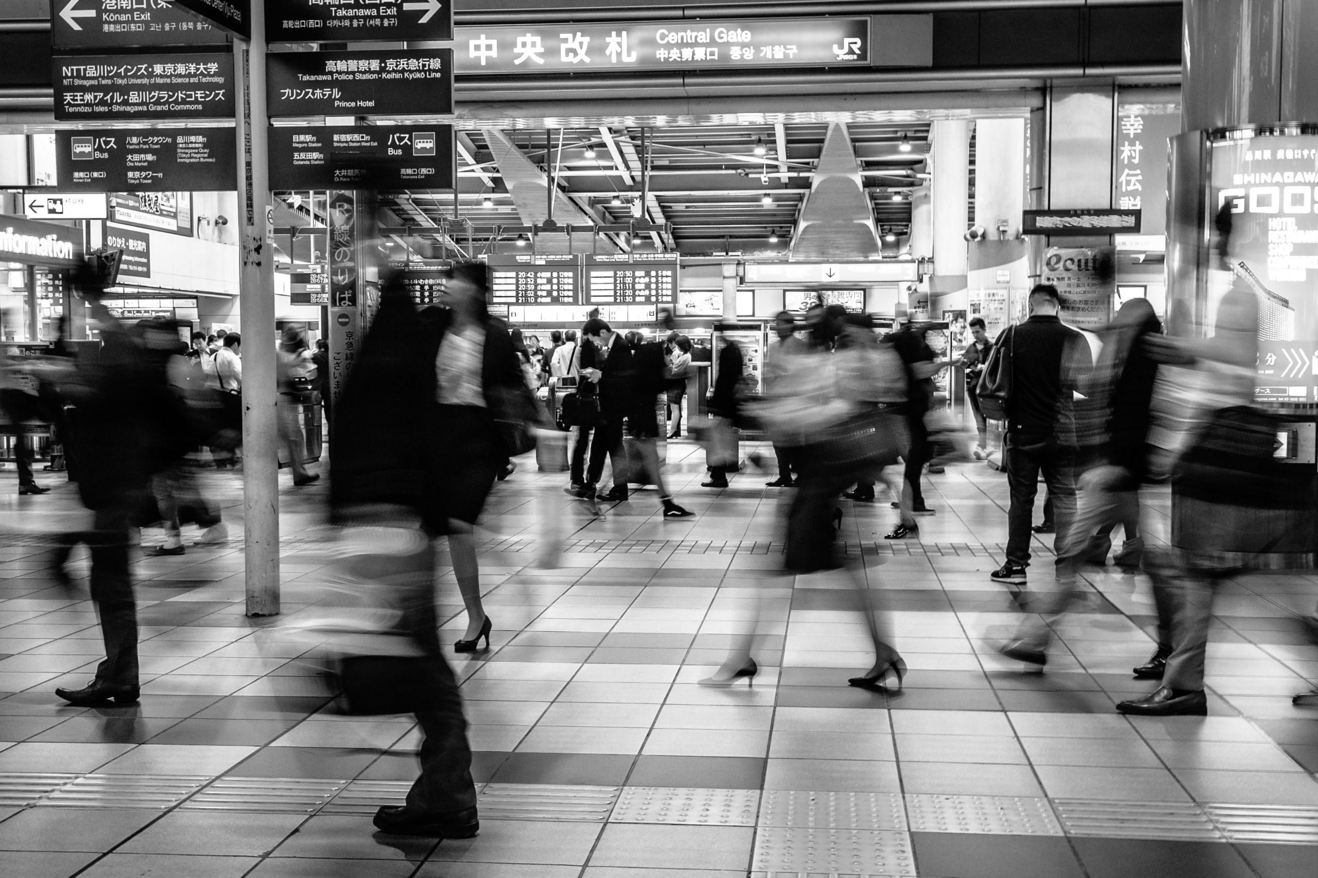 blurry people in train station